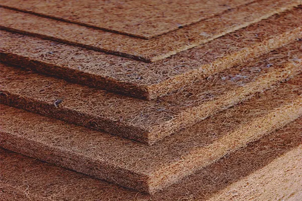 Stacked rubberised coir sheets