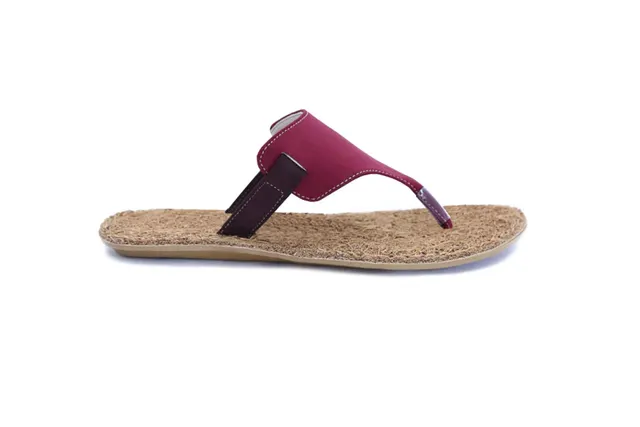 Flip-flop with a coir footbed and a maroon strap